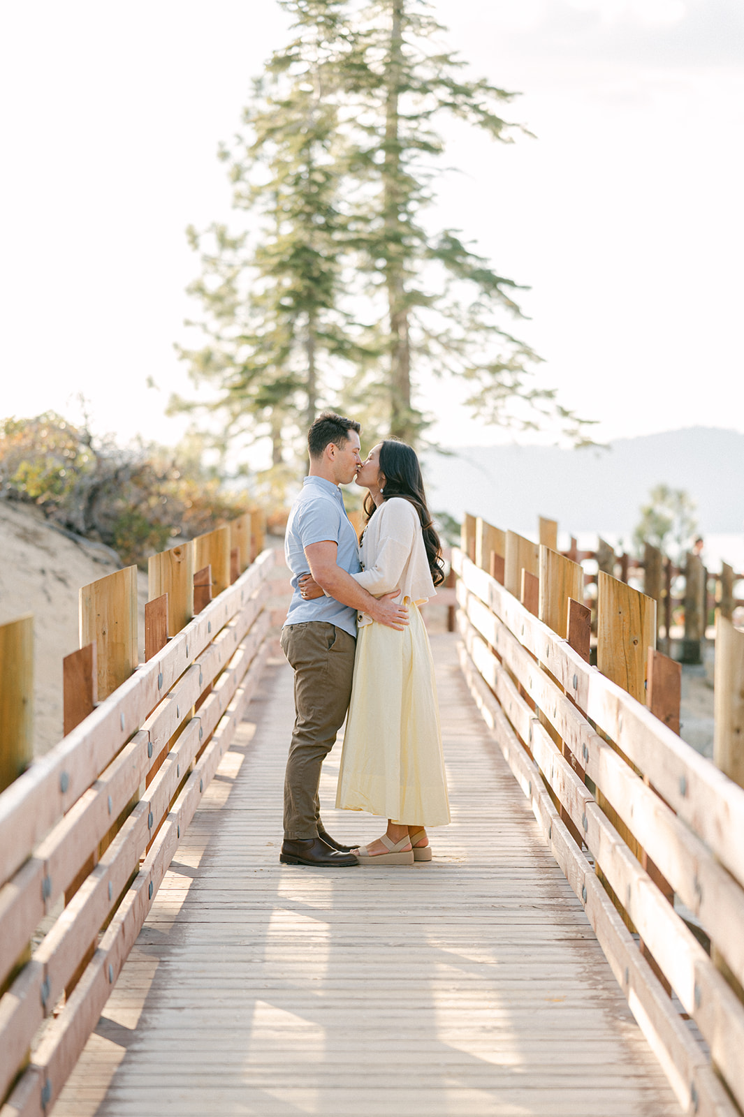 Couple kissing on the Sand Harbor boardwalk, Lake Tahoe.