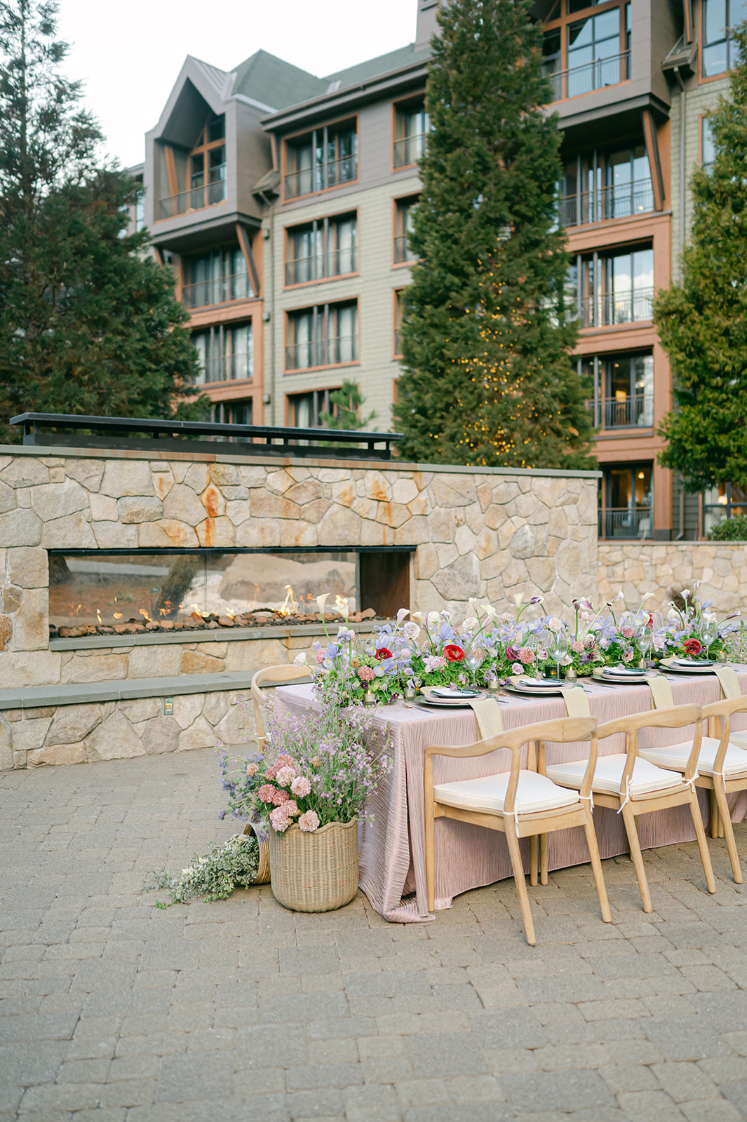 Romantic al fresco wedding dinner table by the fireplace at the Ritz-Carlton Lake Tahoe.