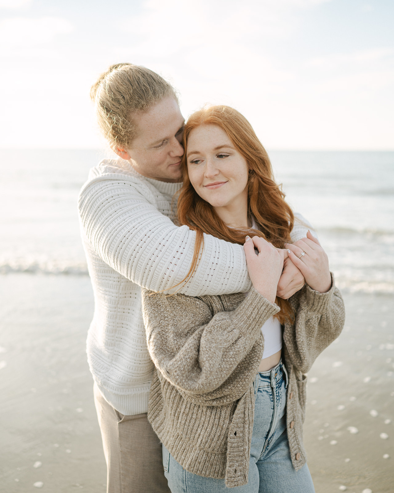 Cozy fall engagement photos at the beach. 