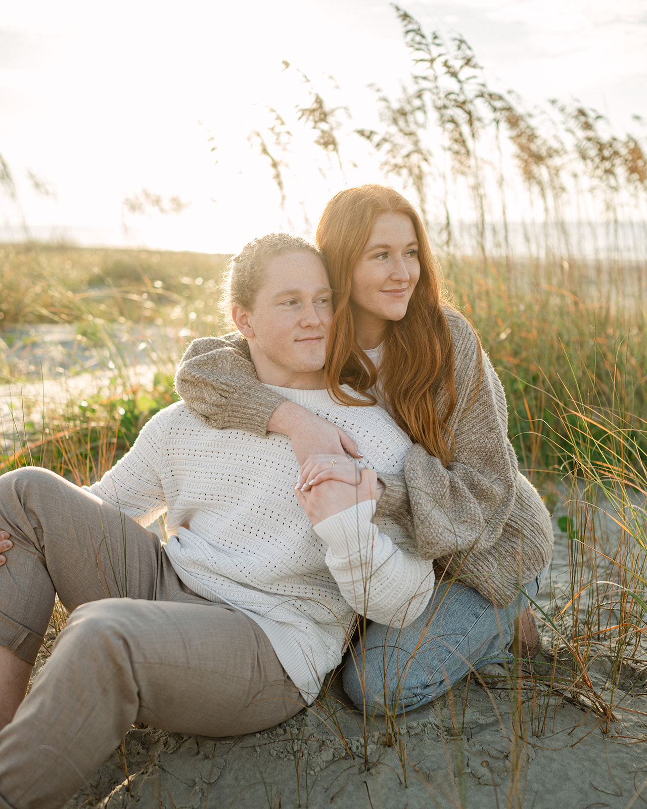Fall engagement photos with chunky knit sweaters.