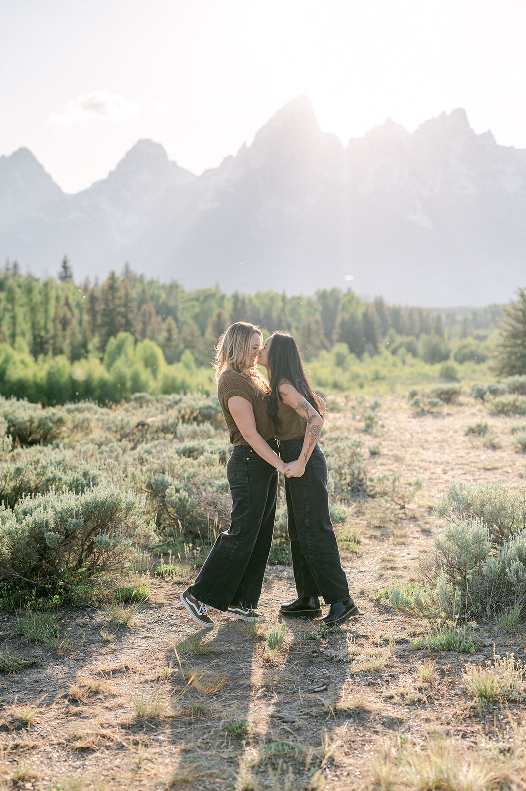 Intimate moment during a Jackson Hole anniversary session with the Tetons in the distance.