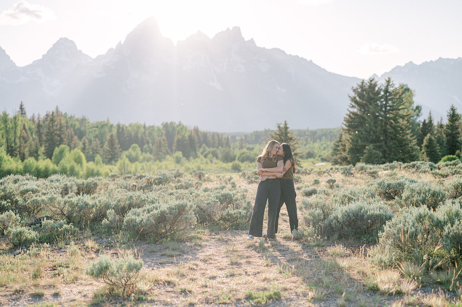 Documentary-style engagement photos in Jackson Hole at sunset. 