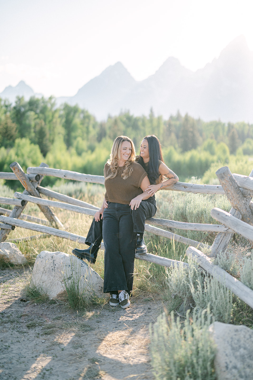 Relaxed couple’s photoshoot in Jackson Hole featuring neutral outfits and scenic Western landscapes.