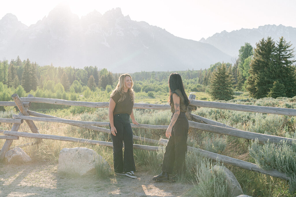 Romantic wlw Jackson Hole couple's session with a mountain backdrop and western influences. 