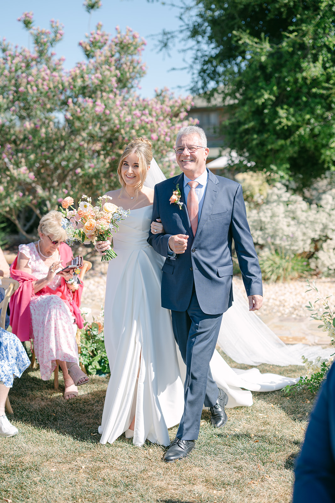 Bride walking down the aisle with father | classic must-have wedding moment.