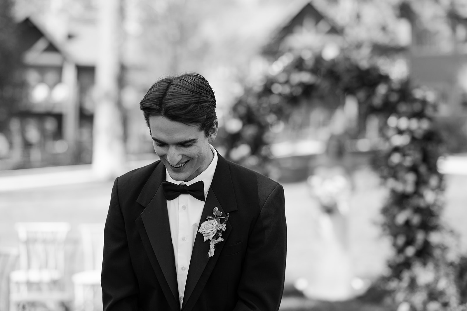 Groom smiling in anticipation of the first look.