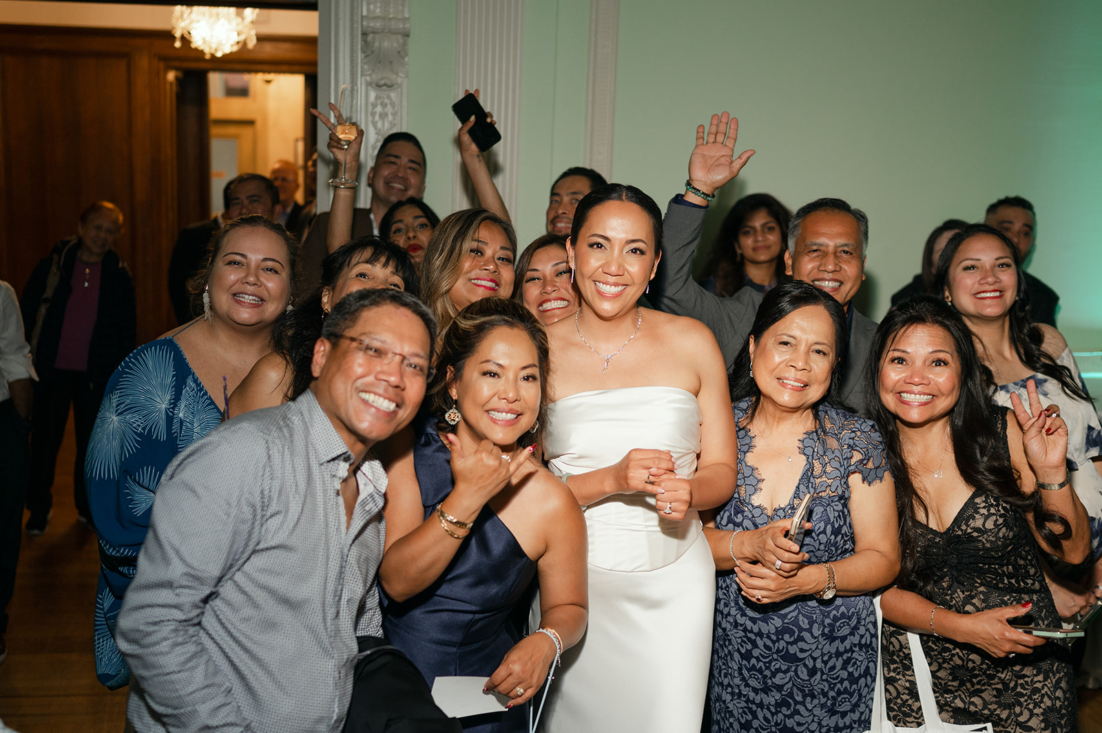 Reception group photo with bride and guests. 