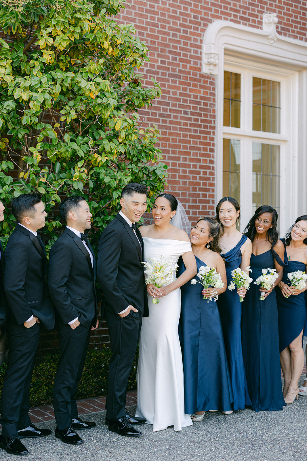 Candid wedding party portraits outside Kohl Mansion in Burlingame.