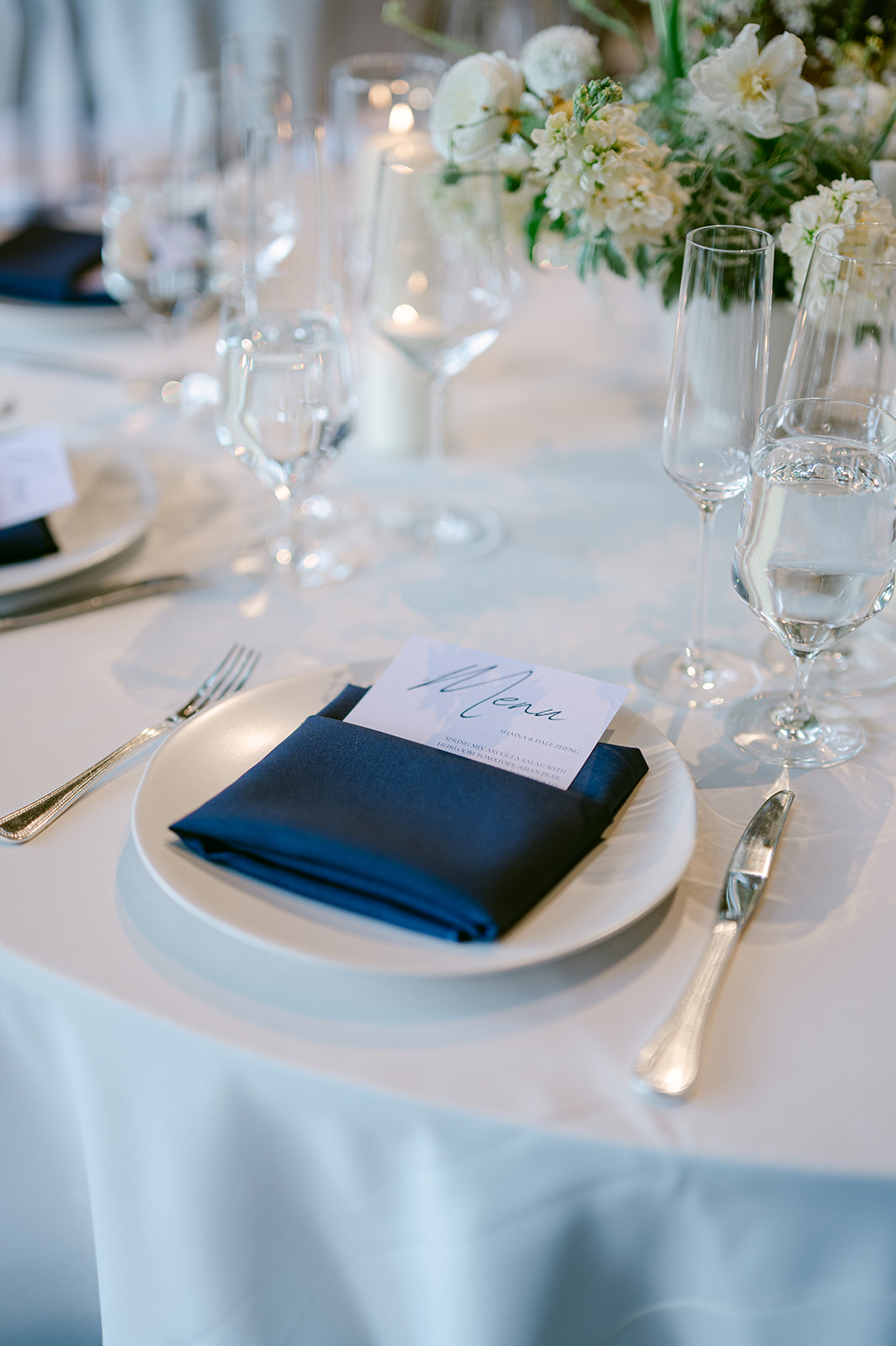 Round tables with minimal, classy décor at Kohl Mansion wedding.