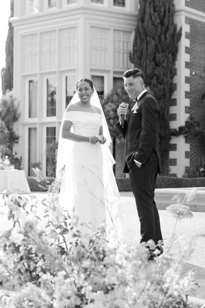 Bride and groom smiling at guests during ceremony in Burlingame.
