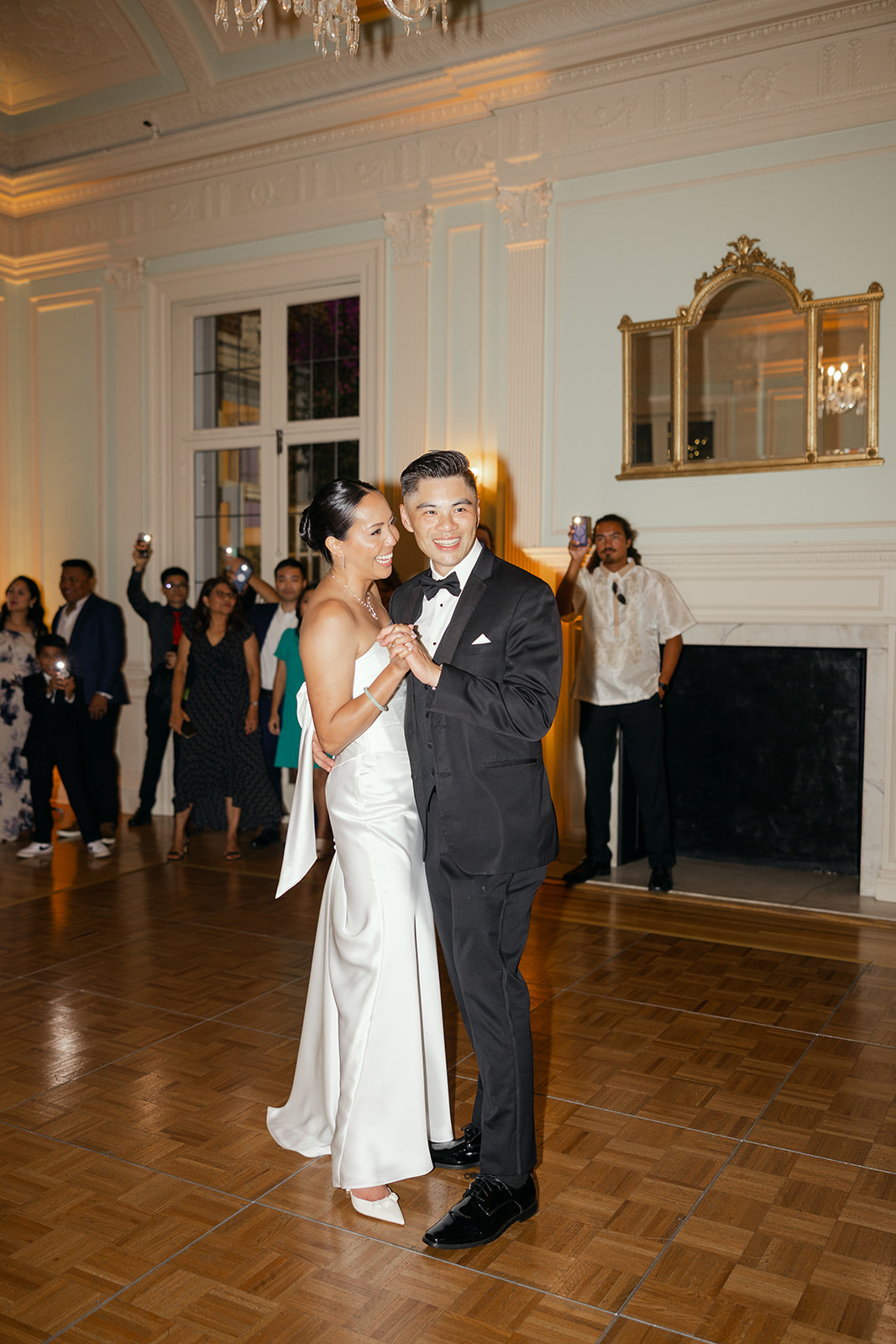 Couple’s first dance inside reception hall at Kohl Mansion.