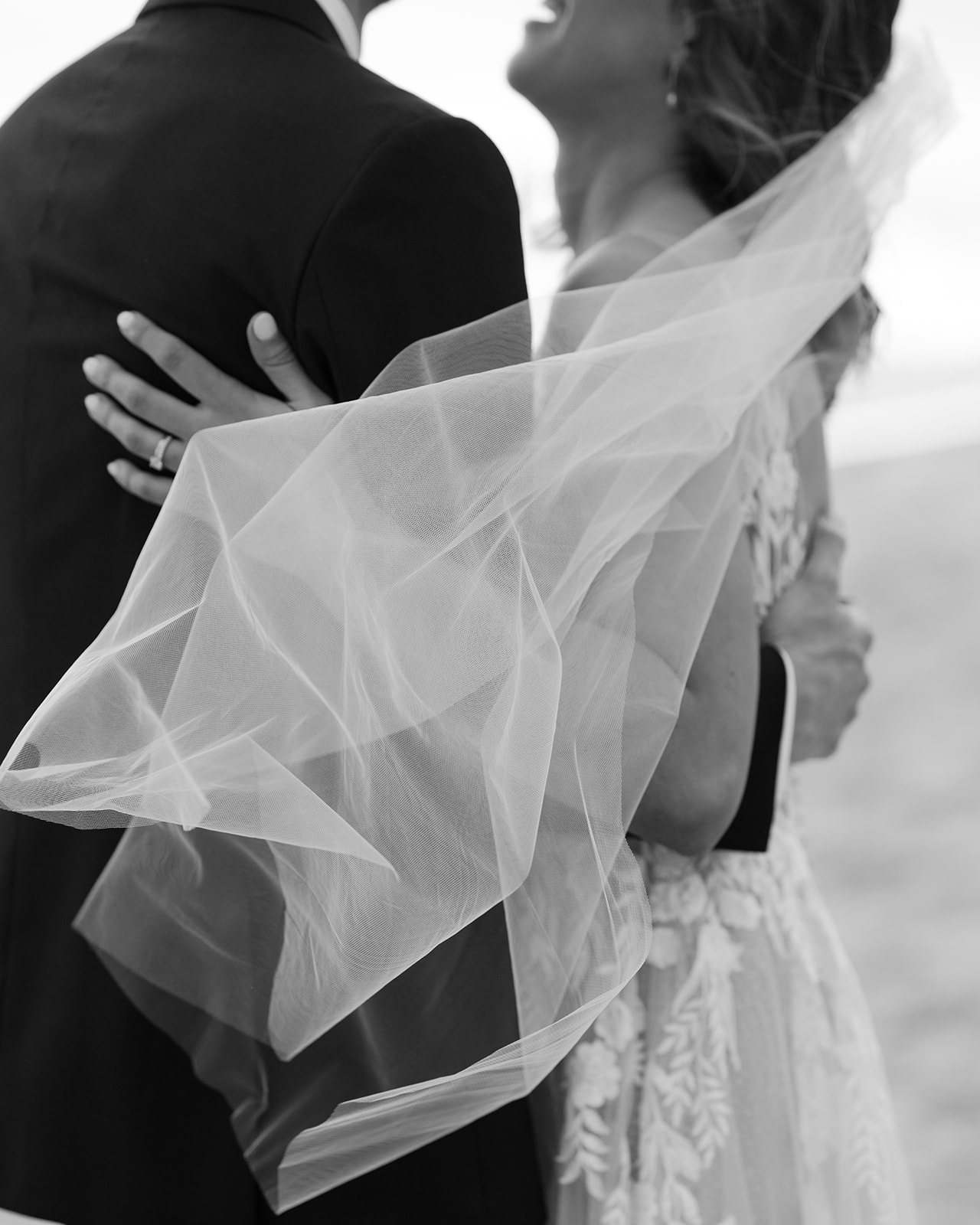 Up close shot of the bride's veil blowing in the wind.