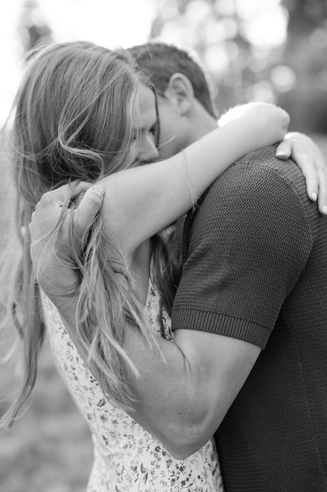 Romantic close-up of couple hugging | timeless documentary engagement photo.