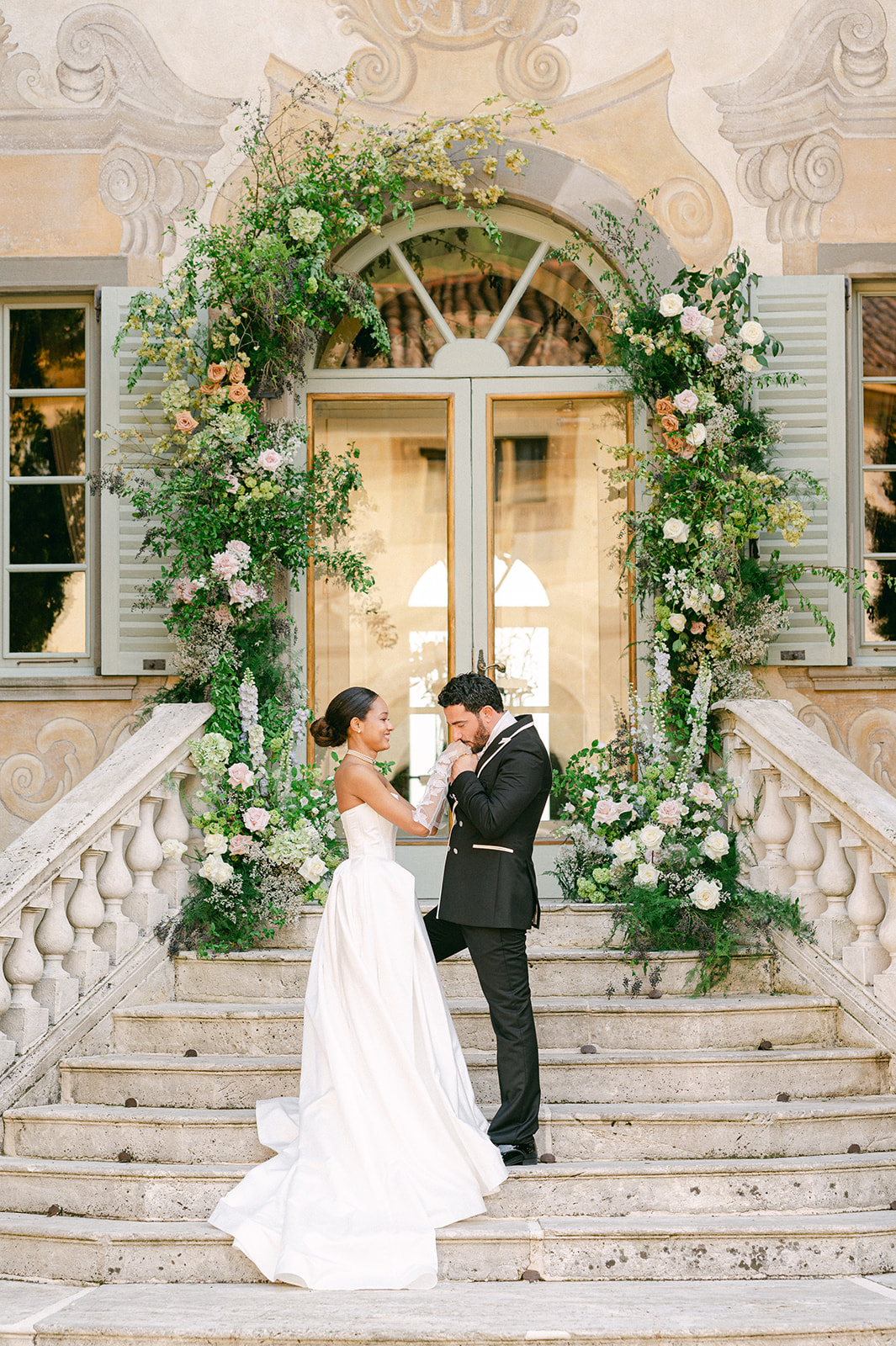 Groom kissing the bride's hand | editorial wedding photography.