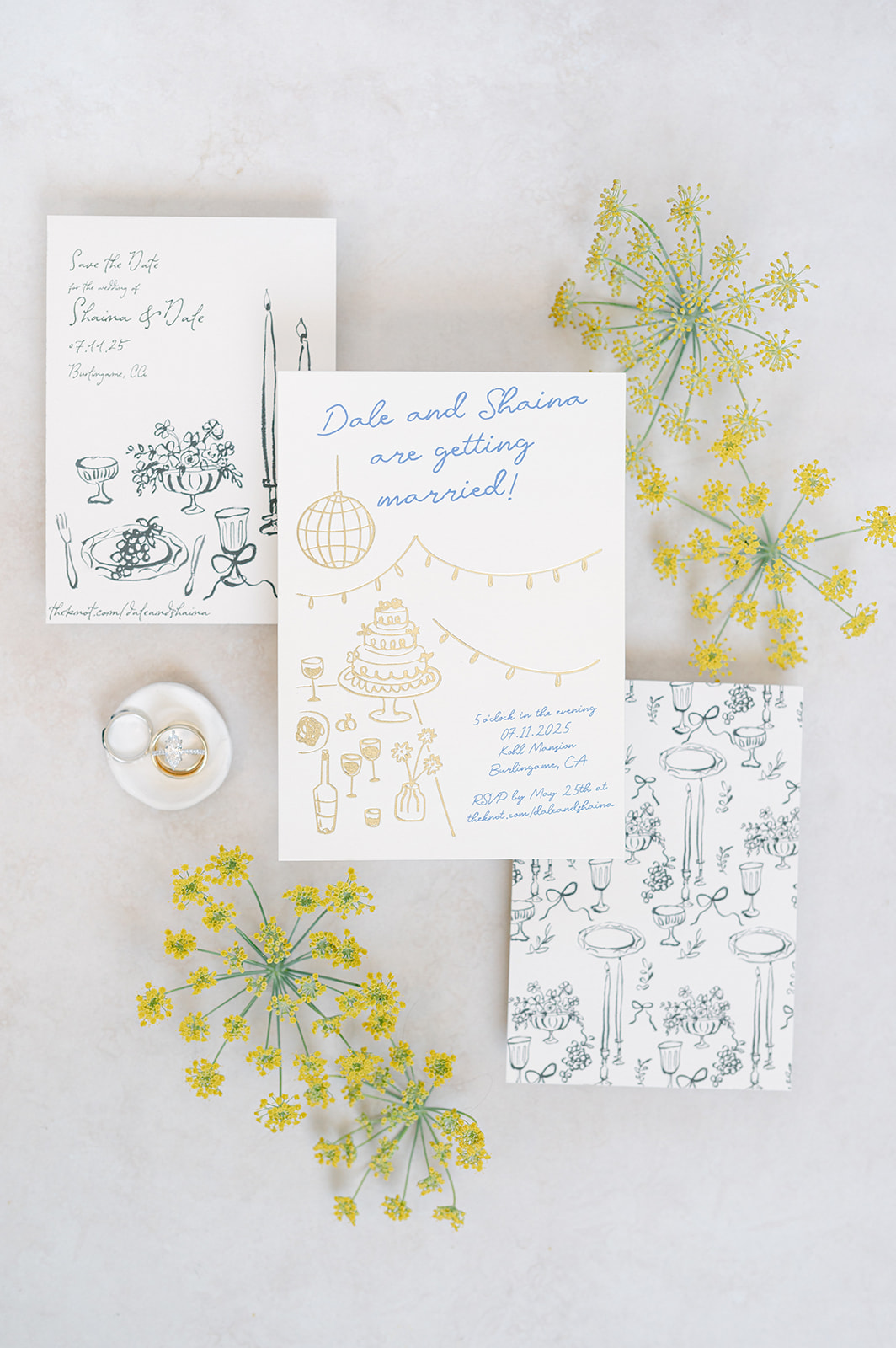 Flat lay of wedding invitations, rings, and accessories | wedding detail photo inspiration.