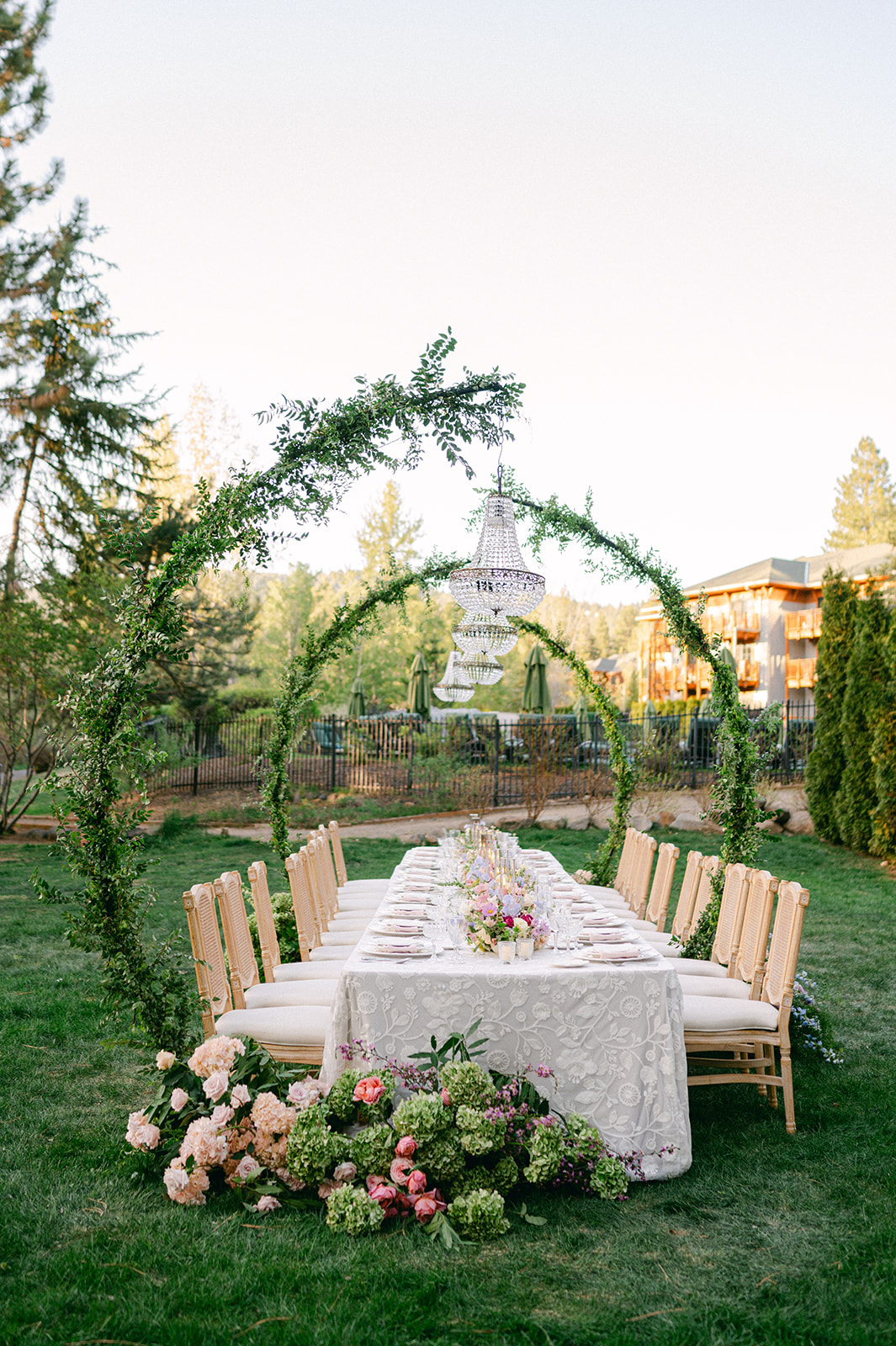 Reception tablescape with candles and greenery | editorial wedding details photo