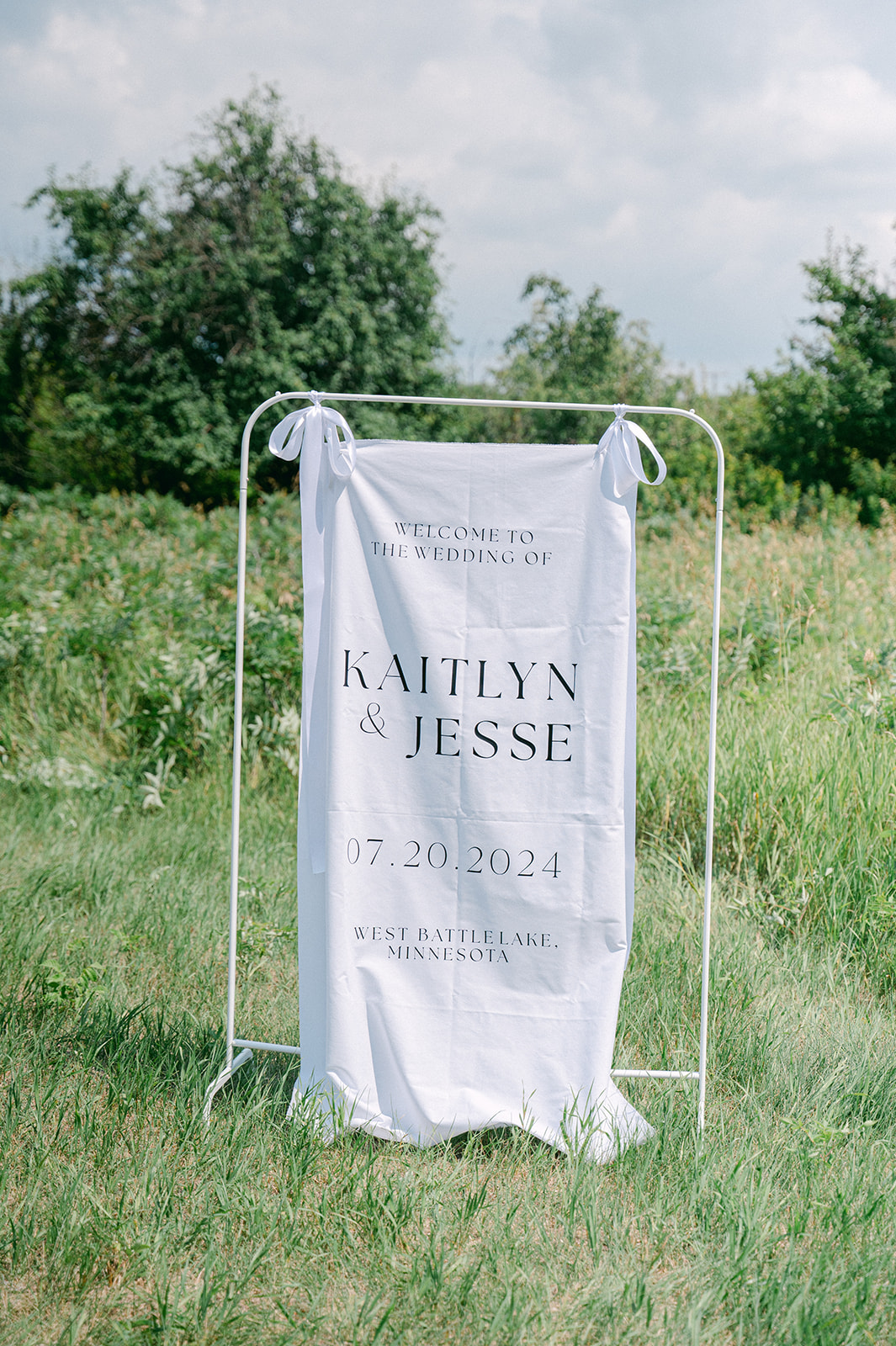 Fabric wedding welcome sign | wedding ceremony detail shot.