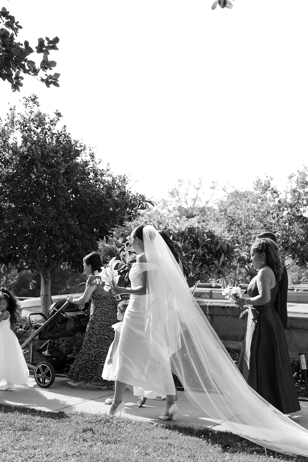 Bride and wedding party walking to the reception | candid wedding photography.