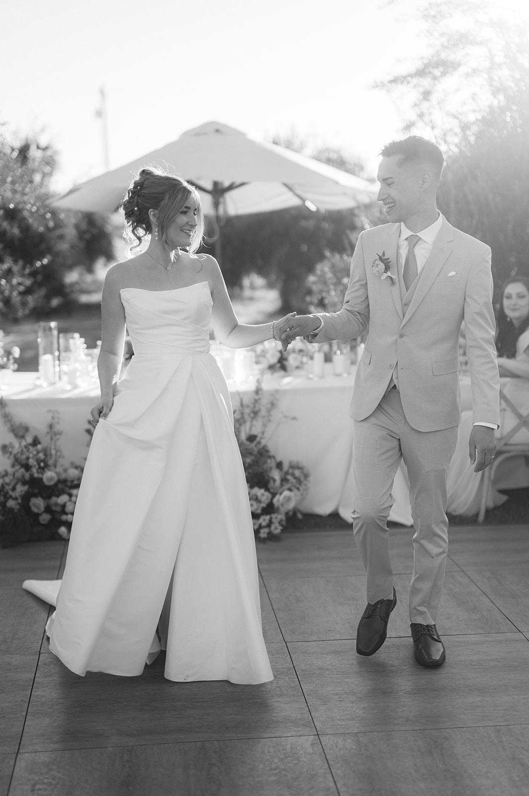 Couple’s first dance surrounded by guests | classic documentary wedding reception photo.