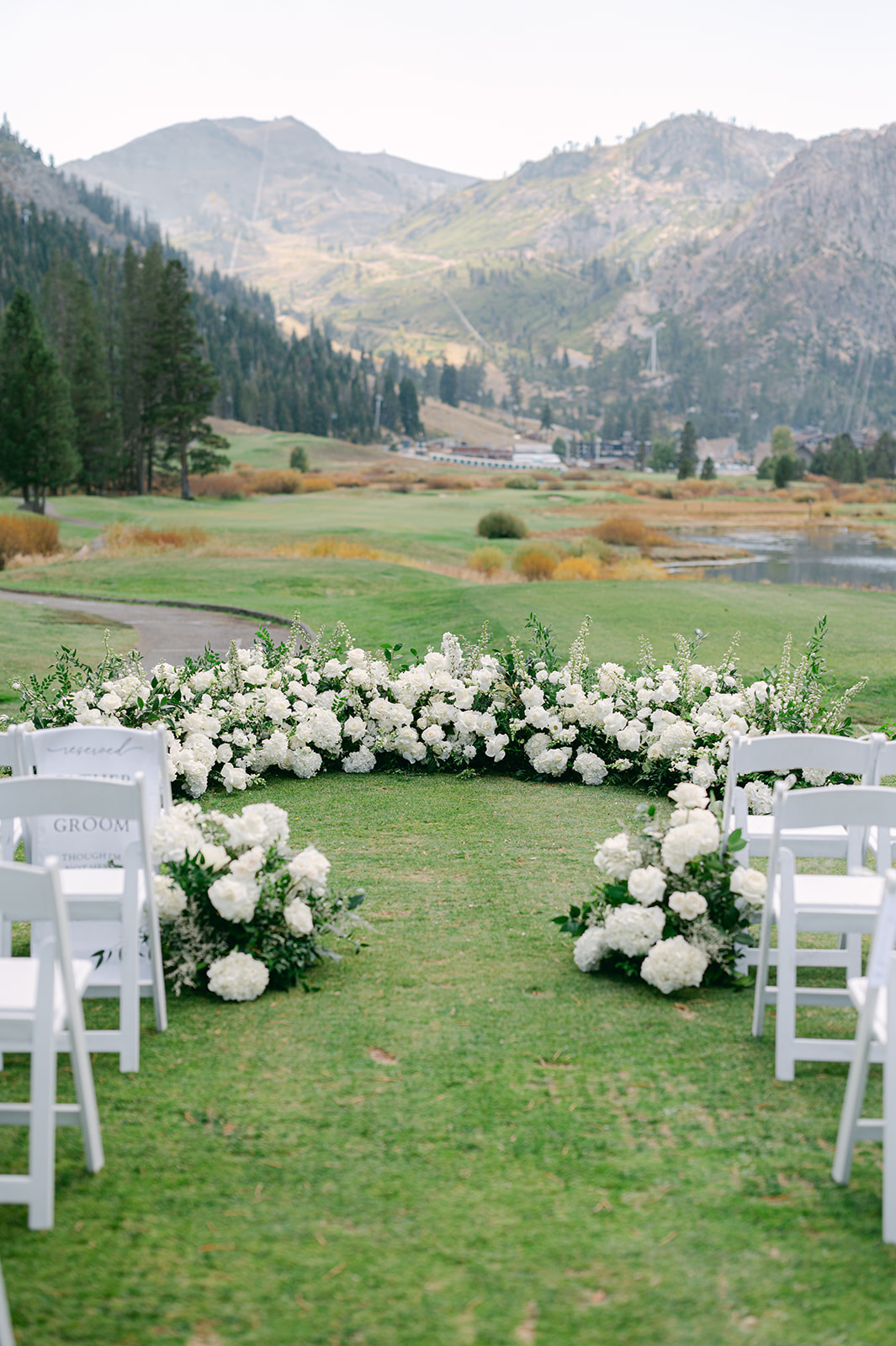 Grounded floral arch wedding ceremony at Everline Resort Lake Tahoe.