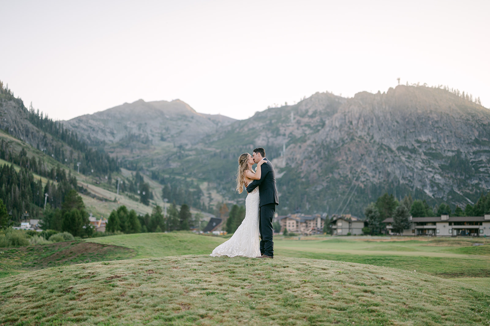 Lake Tahoe Wedding Couple kisses during wedding portraits by Sarah Woods