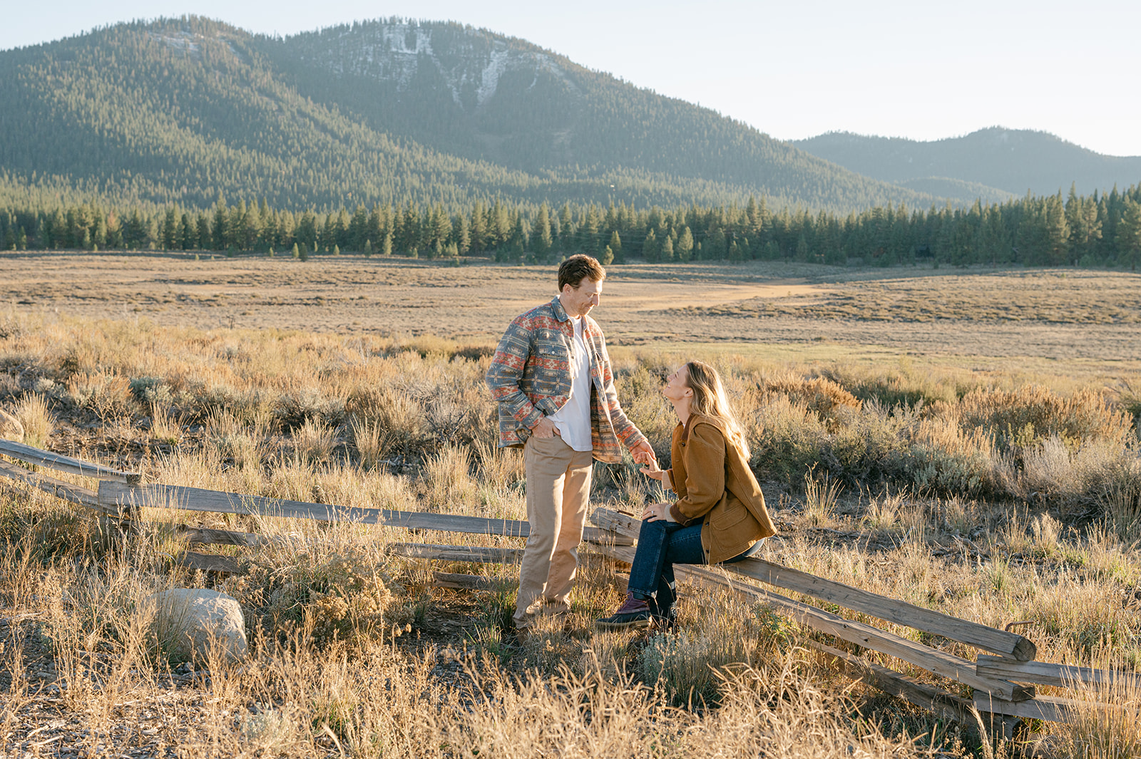 Playful engagement photos in Truckee’s Martis Valley during peak fall colors.
