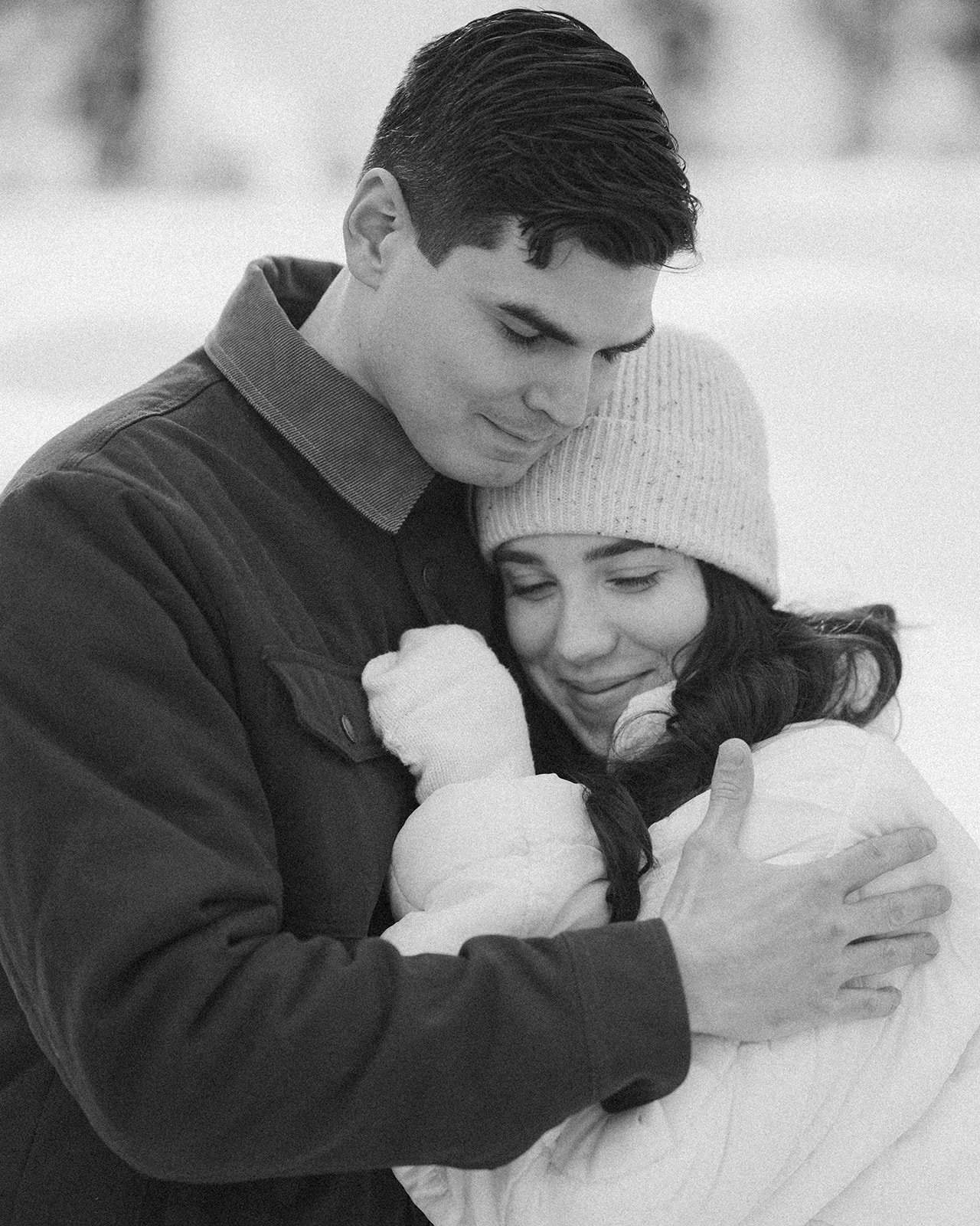 Candid moment of a couple during their winter engagement photos. 