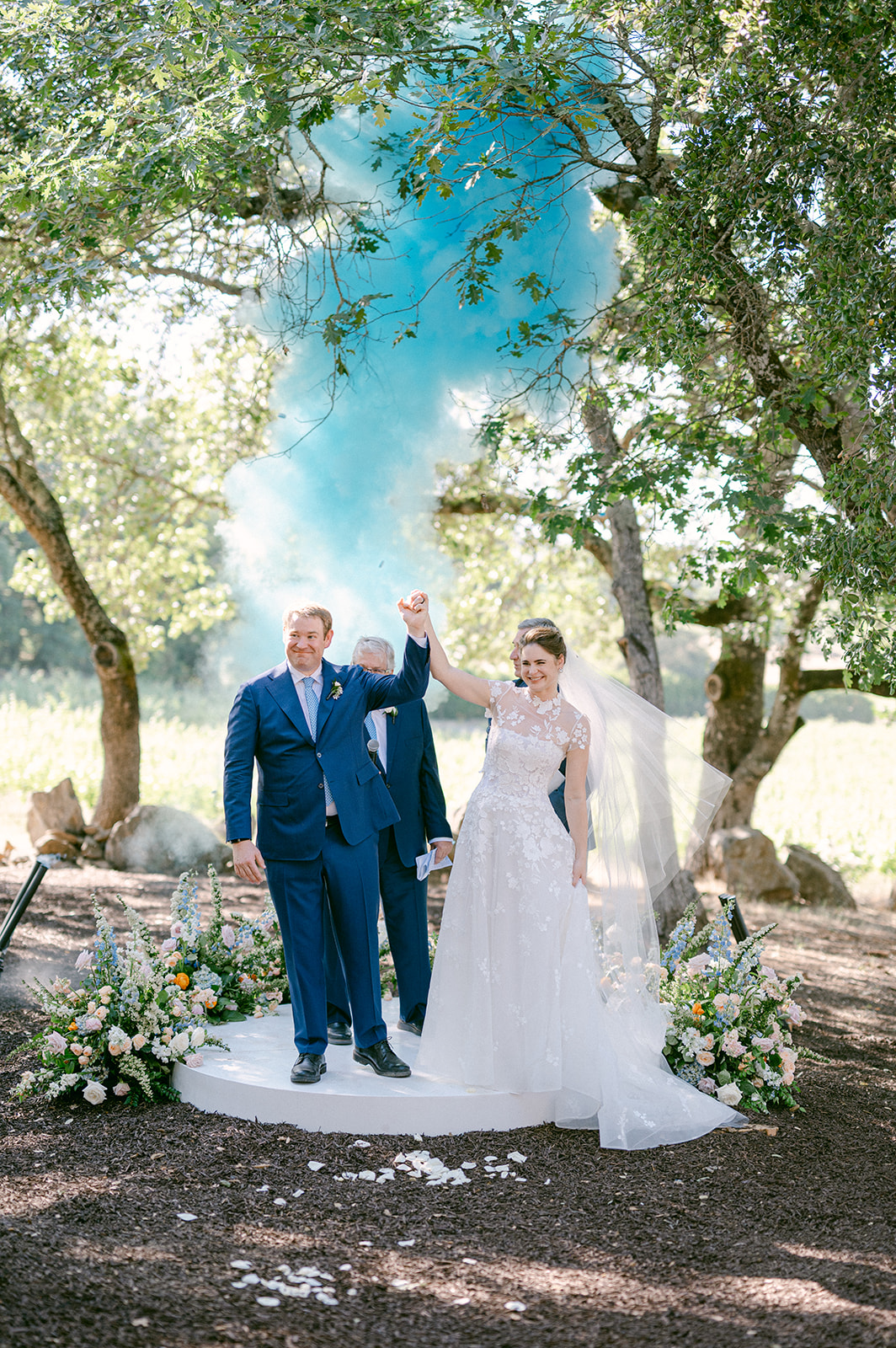 Chalk cannons after first kiss at Napa vineyard wedding.