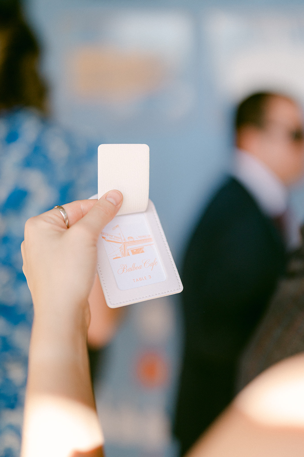 Custom luggage tag wedding seating chart details.
