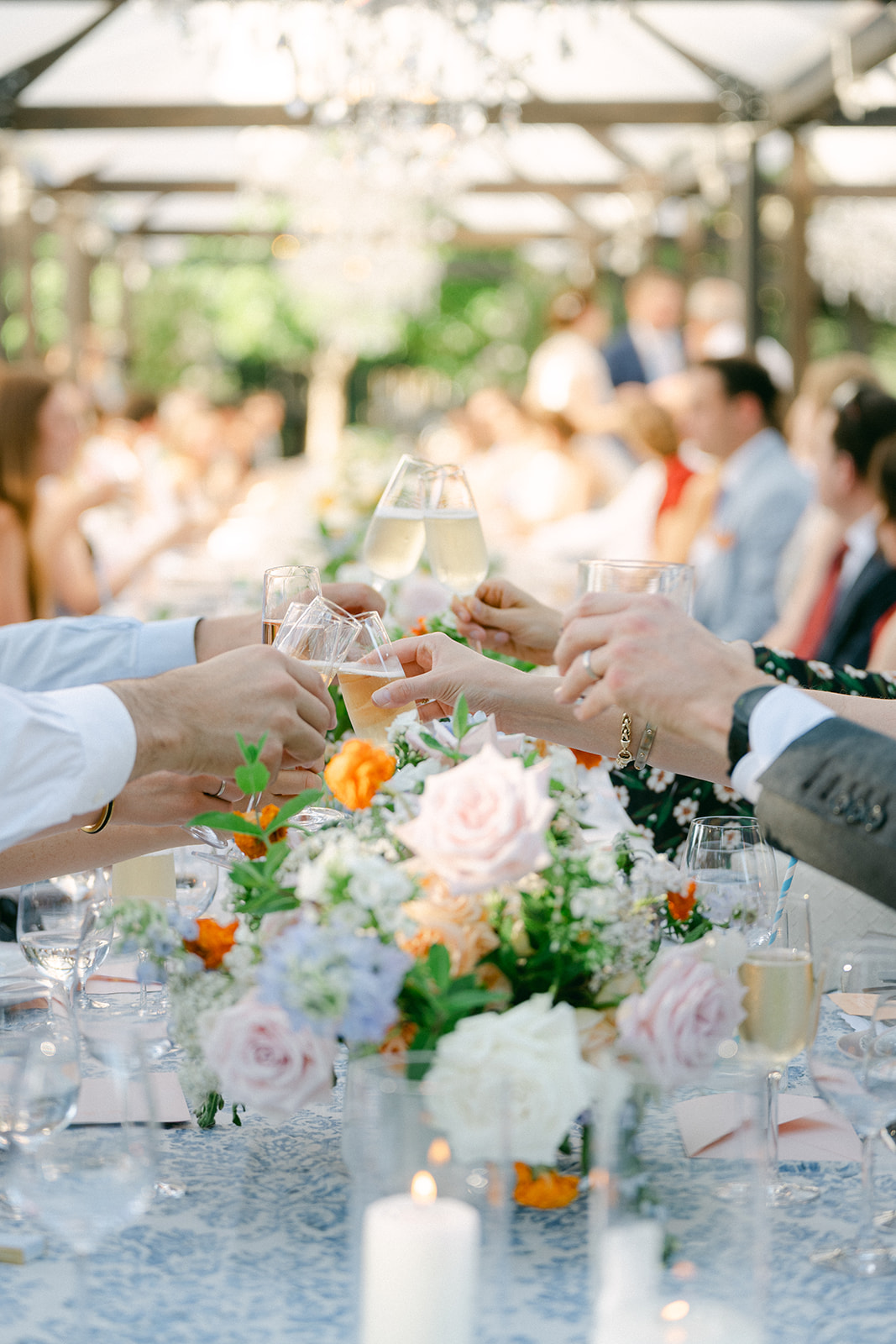 Guest cheers at a romantic floral reception in Napa.