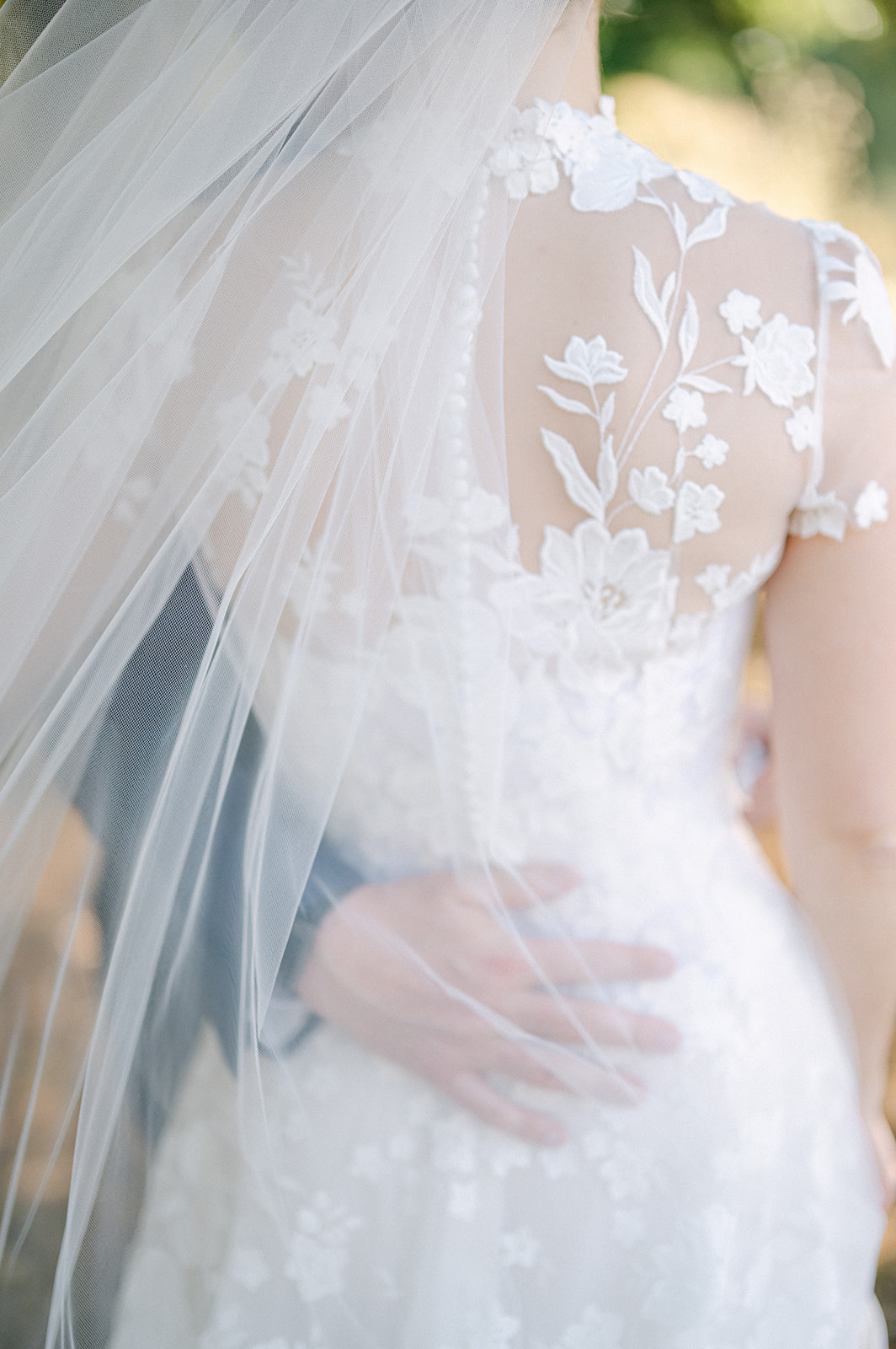 Intimate first look photos at a family vineyard wedding.