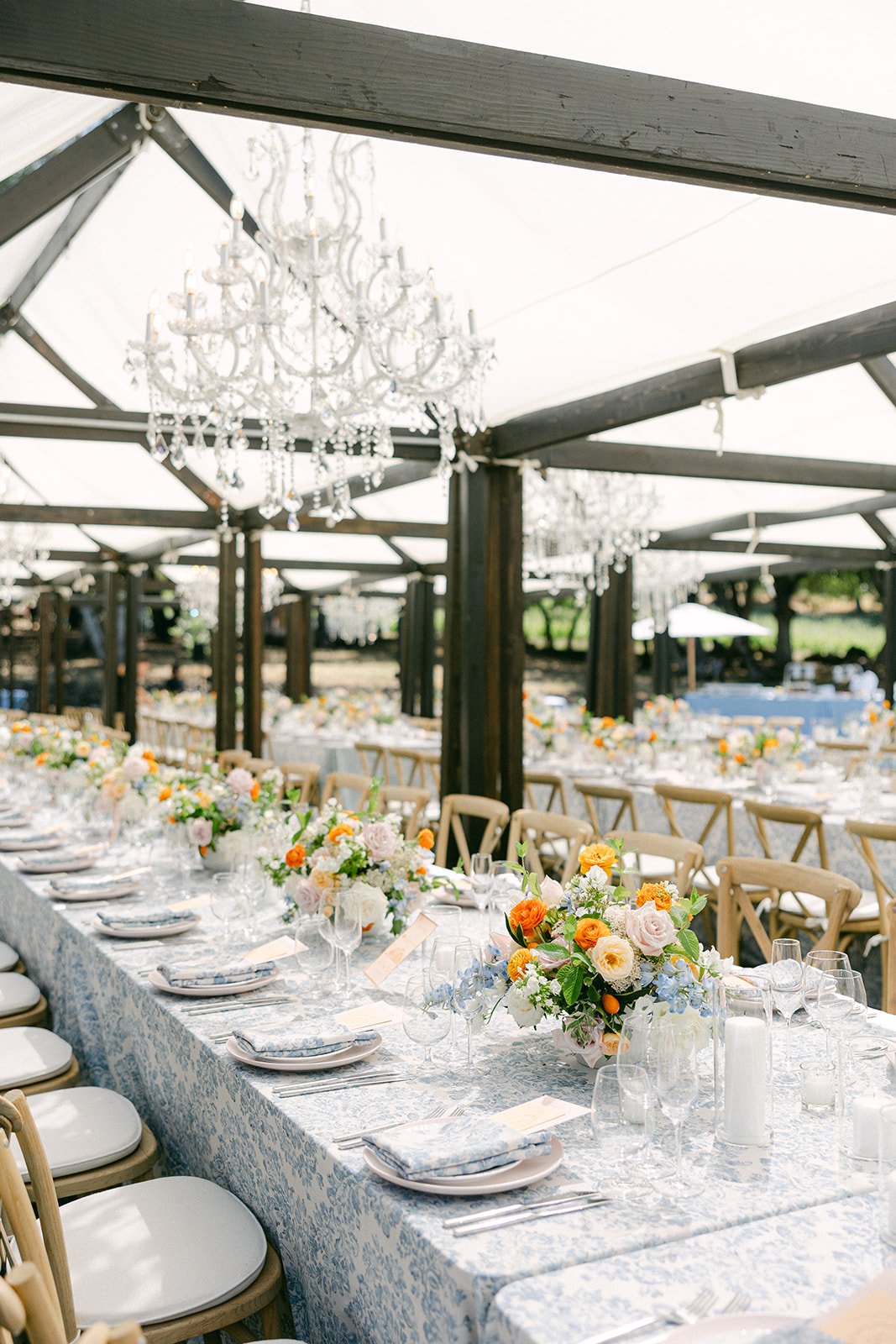 Long family-style tables at Napa vineyard wedding reception.