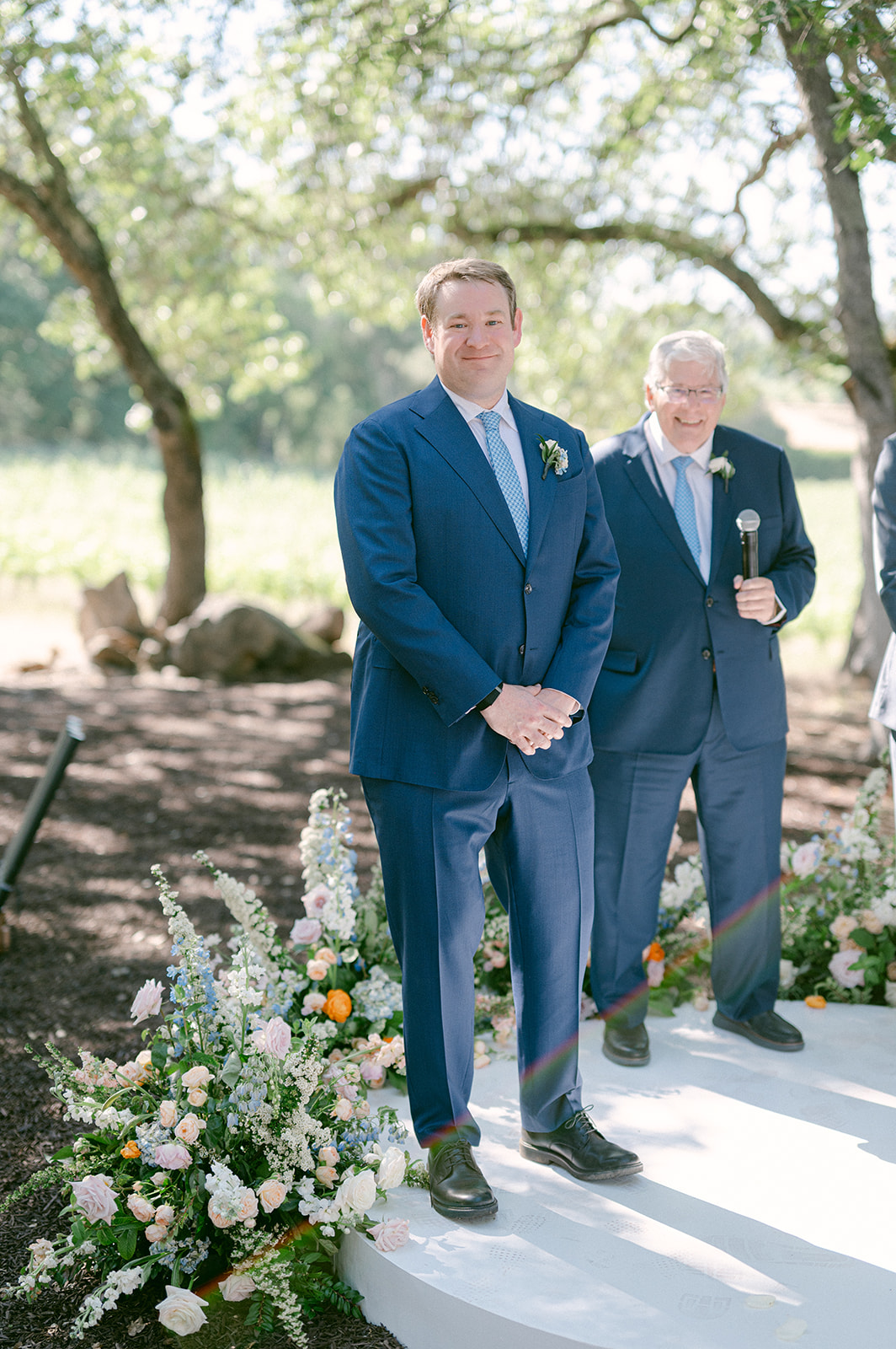 Groom reaction during an emotional outdoor vineyard ceremony in Napa Valley.