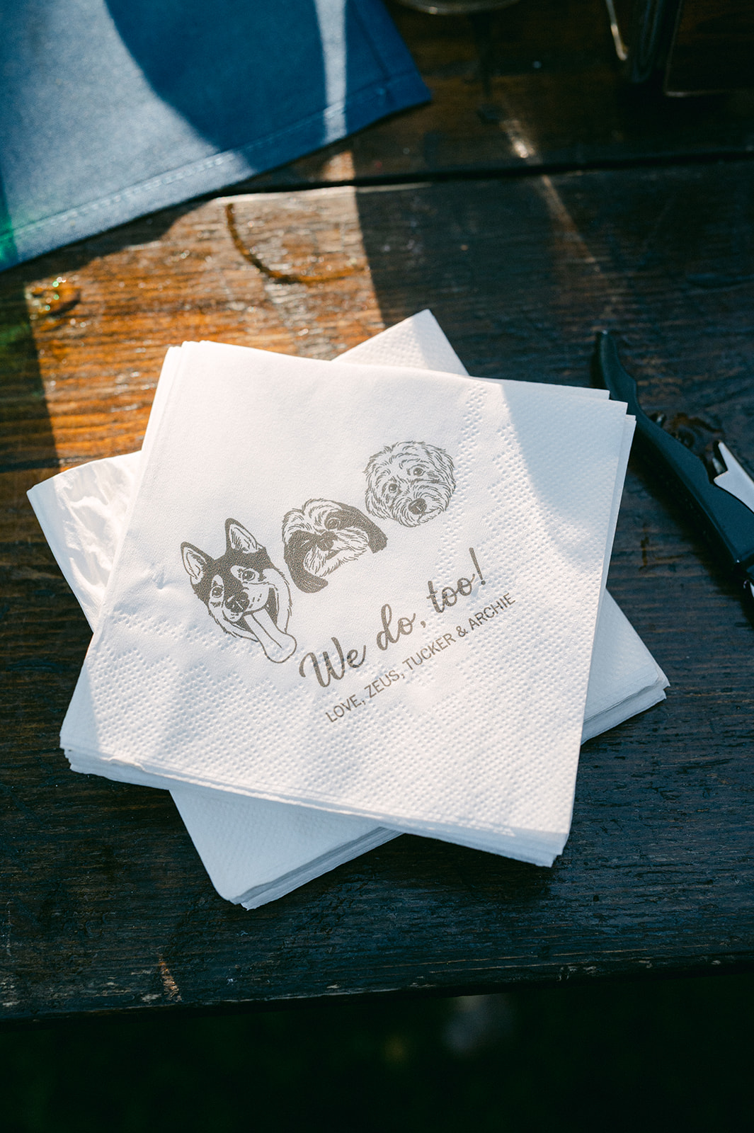 Detail shot of the couple’s custom dog-illustrated napkins displayed at the Hyatt welcome party.