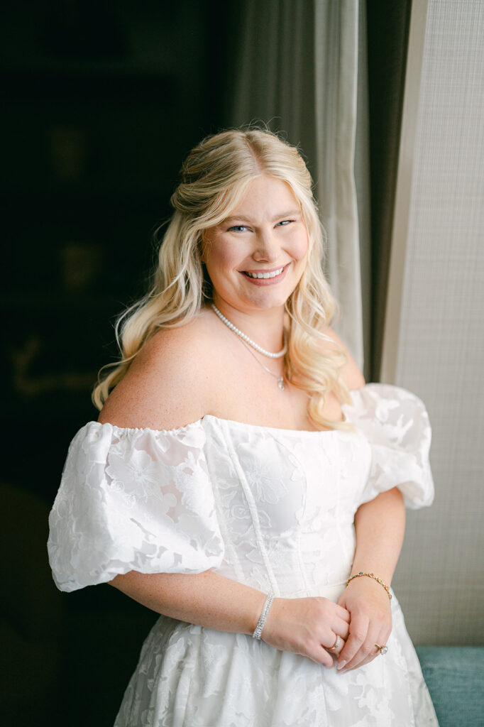 Bridal portrait standing in front of a window at the Hyatt in Incline Village.