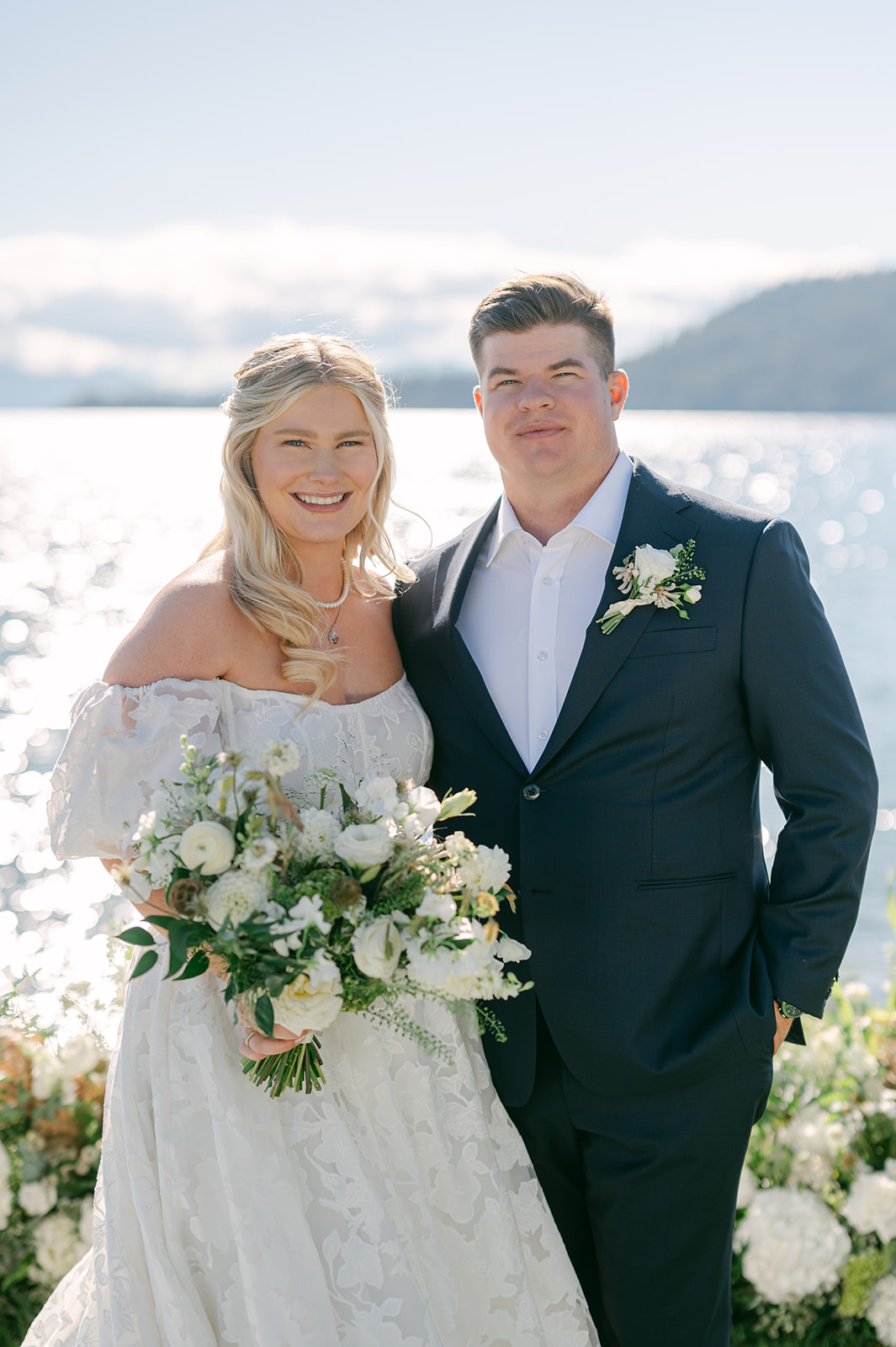 Bride and groom portrait by the lake after their ceremony.