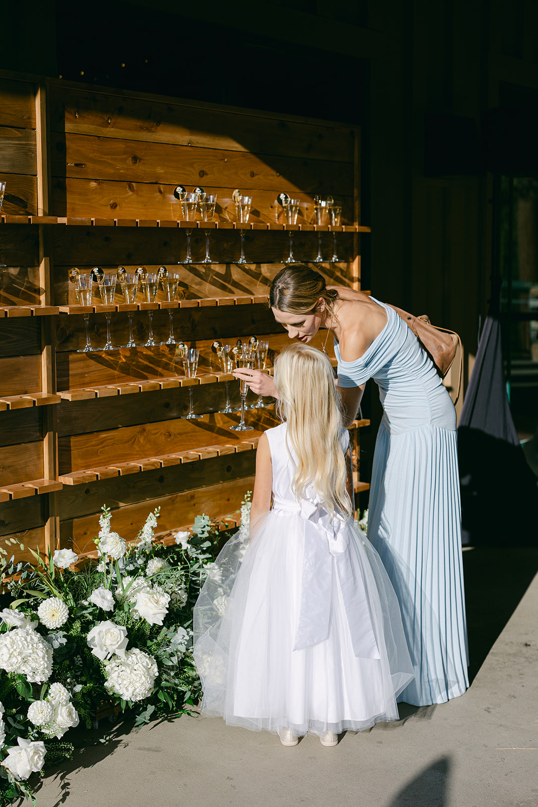 Guests getting a drink from a champagne wall at cocktail hour at The Chateau at Incline Village/