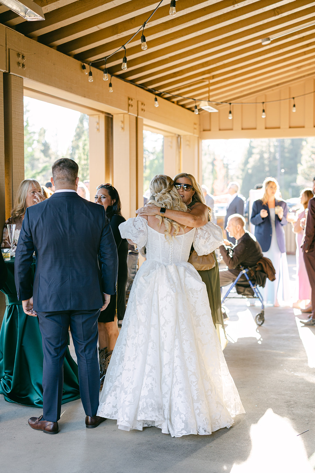 Bride, groom and guests mingling and relaxing during cocktail hour.
