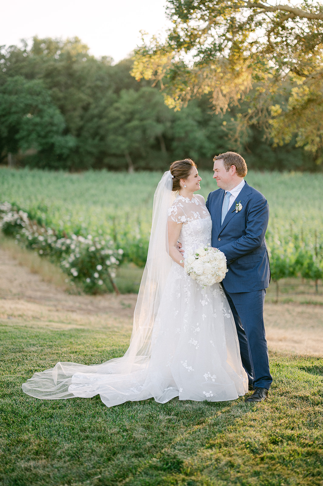 Candid couple portraits at a luxury Napa vineyard wedding.