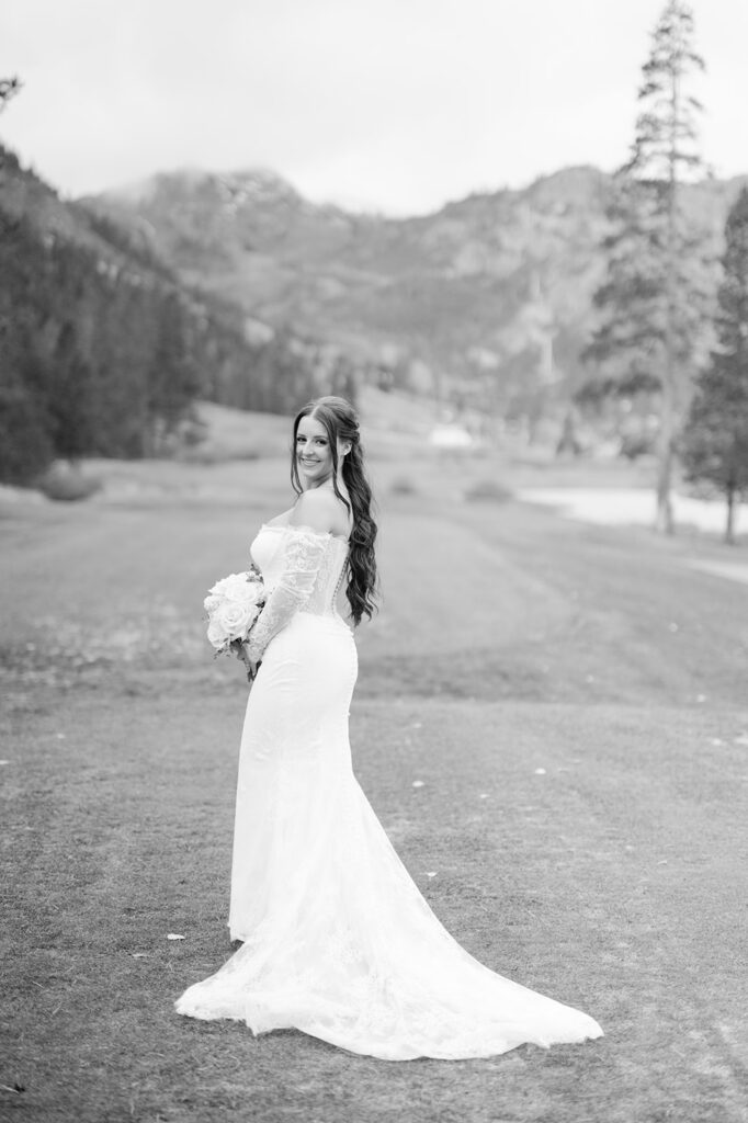 Bride smiles for portrait in Olympic Valley